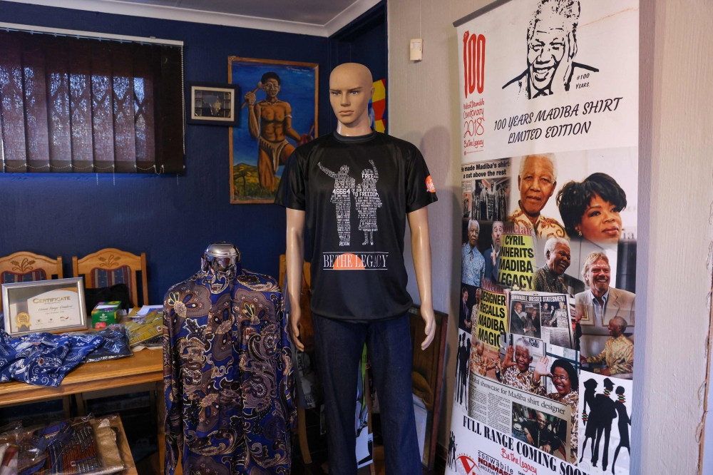 A general view of some of the latest designs of Sonwabile Ndamase, who used to design and style for the late former President of South Africa Nelson Mandela and the designer of the original Madiba shirt, in his studio in Johannesburg on July 4, 2024. — AFP pic 