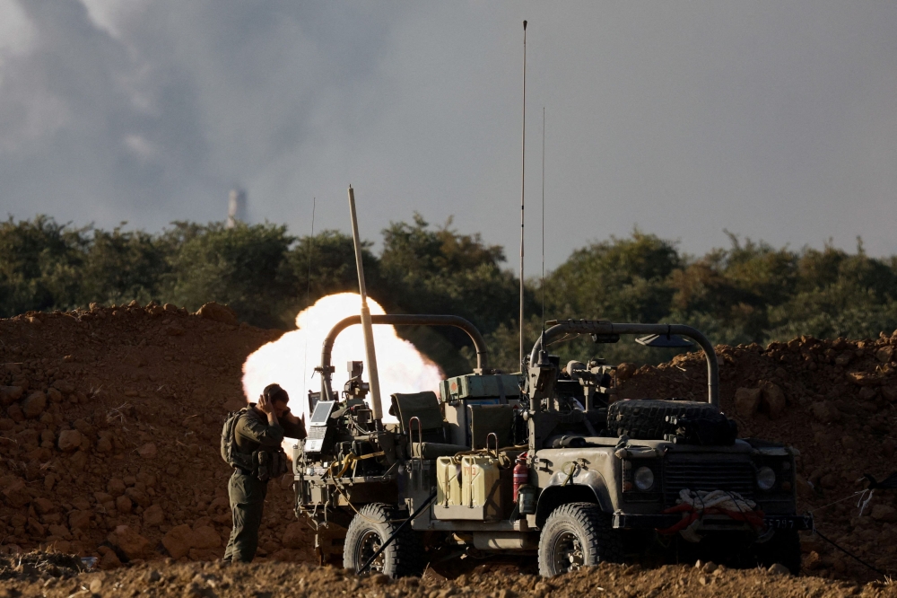 An Israeli soldier fires a mortar, amid the Israel-Hamas conflict, near the Israel-Gaza border, in Israel, July 9, 2024. — Reuters pic 
