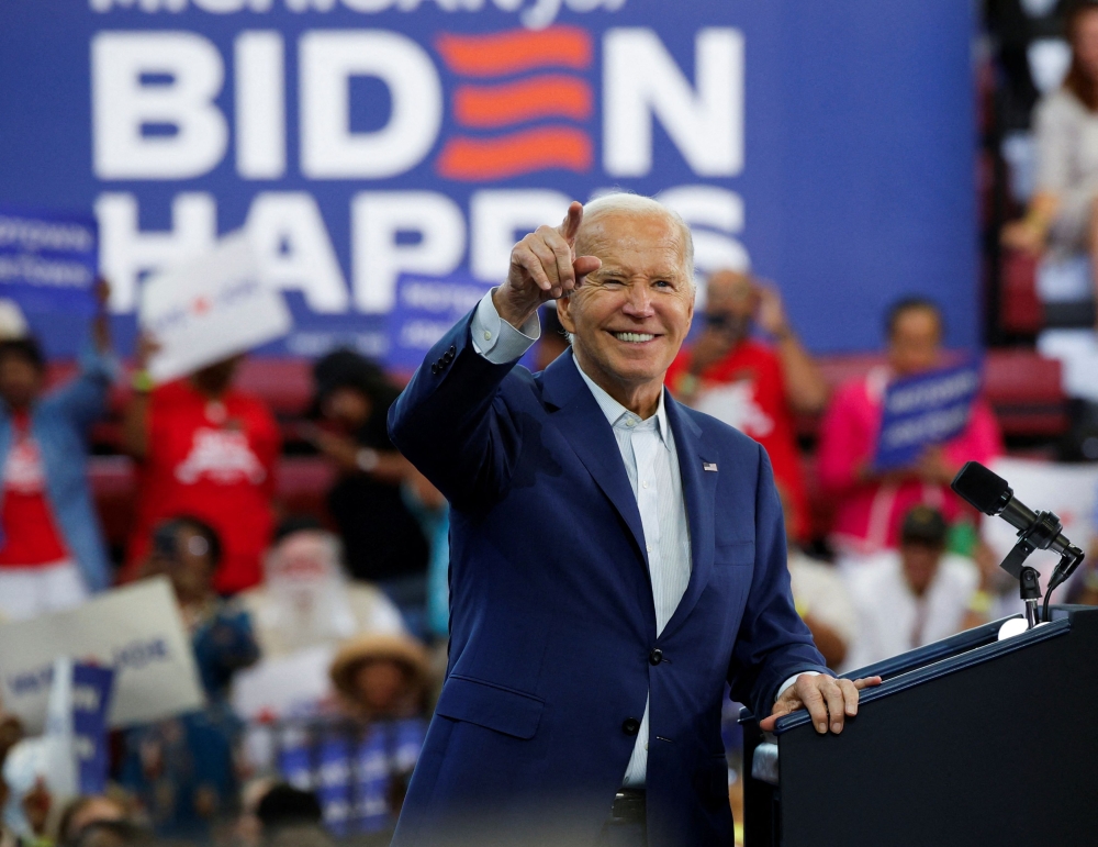 US President Joe Biden reacts to the audience during a campaign stop in Detroit, Michigan July 12, 2024. — Reuters pic  