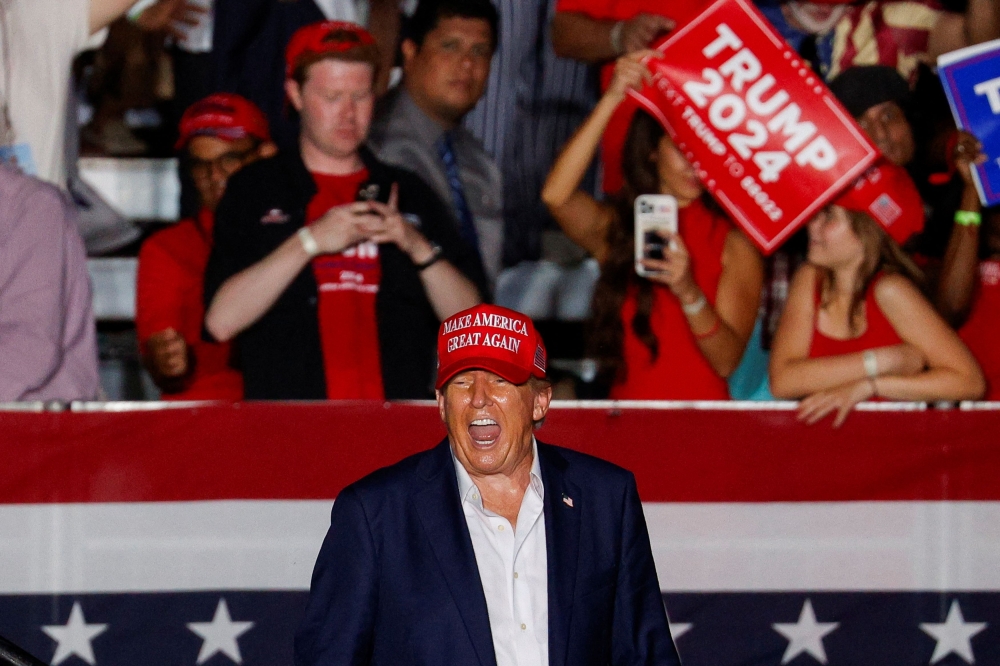 Republican presidential candidate and former U.S. President Donald Trump reacts during a campaign rally at his golf resort in Doral, Florida July 9, 2024. — Reuters pic  
