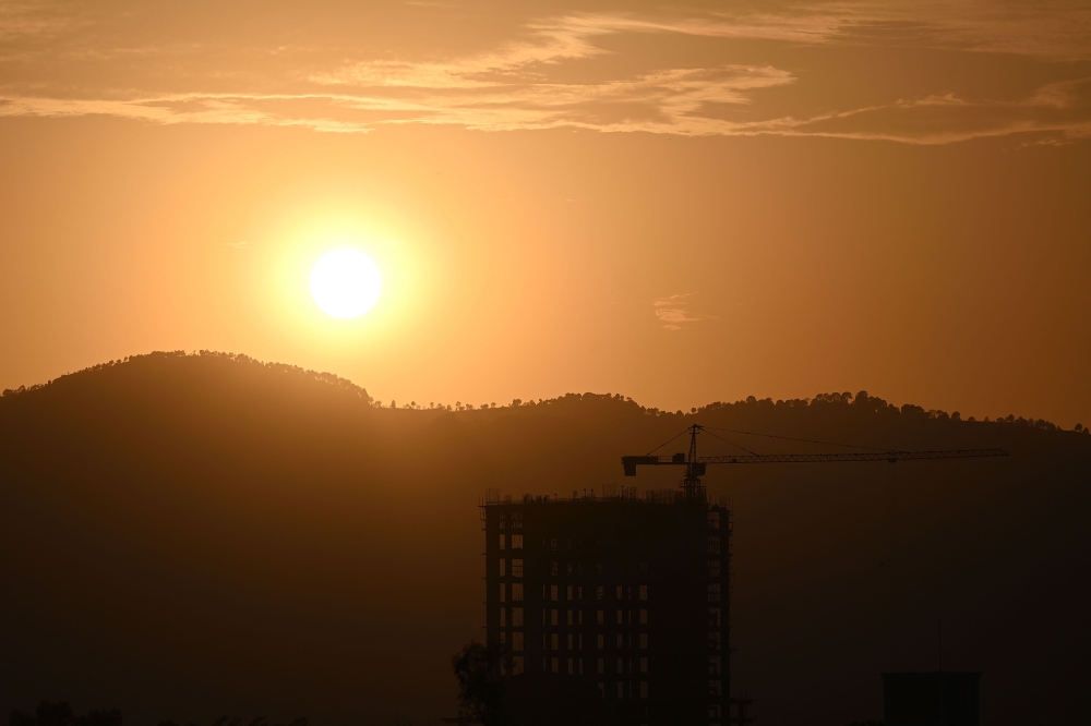 An under-construction building is pictured during the sunset in Islamabad July 8, 2024. The IMF said it reached a new US$7 billion (RM32 billion) loan deal with Pakistan in a bid to bolster its faltering economy. — AFP pic