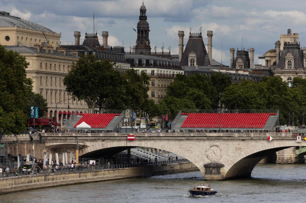 French Sports Minister Amelie Oudea-Castera swam in the Seine today, raising hopes the river will be clean enough for competitors at the Paris Olympics which start in less than a fortnight. — AFP pic