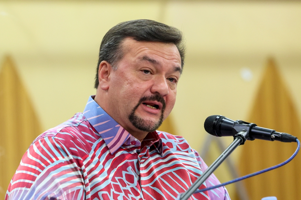 Minister of Finance II Datuk Seri Amir Hamzah Azizan delivers a speech during the inauguration of the G1 Contractors Convention in Kuantan July 13, 2024. — Bernama pic