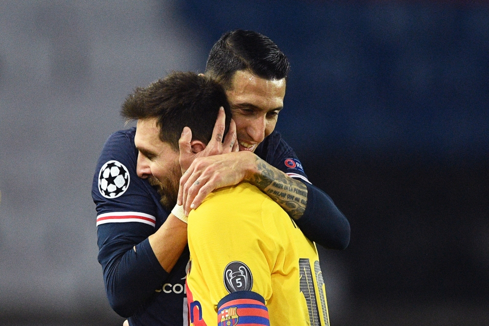 File picture of Paris Saint-Germain’s Argentinian midfielder Angel Di Maria hugging Barcelona’s Argentinian forward Lionel Messi after the Uefa Champions League round of 16 second leg football match between Paris Saint-Germain (PSG) and FC Barcelona at the Parc des Princes stadium in Paris, on March 10, 2021. Messi has said that he wants to win this Copa for Di Maria, nicknamed El Fideo, the noodle, due to his skinny frame. — AFP pic 