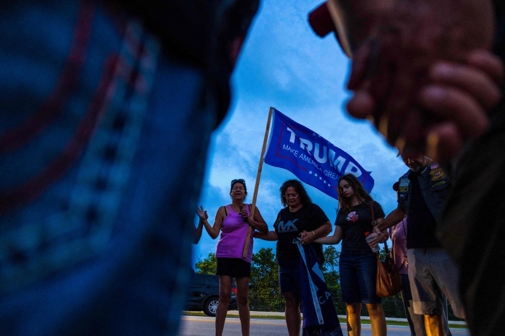 Political leaders on both sides of the aisle slammed the violence minutes after the Republican candidate was rushed off stage by the Secret Service with blood running down his face. — AFP pic