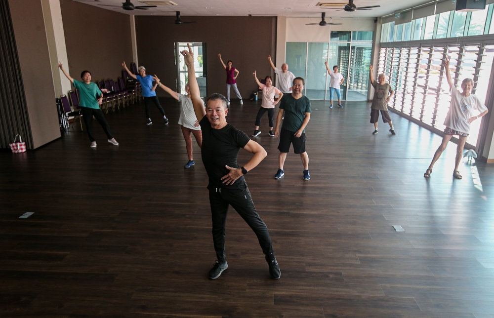 Residents at GreenAcres during one of their Zumba session. — Picture by Farhan Najib