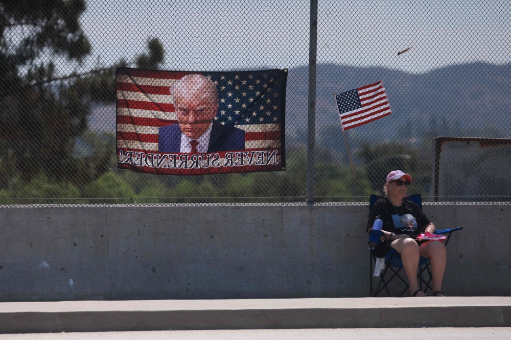 A supporter of former US president and Republican presidential candidate Donald Trump gather for an impromptu rally “Stand Up for Trump” in Simi Valley, California, a day after he was shot at during a rally in Pennsylvania. — AFP pic