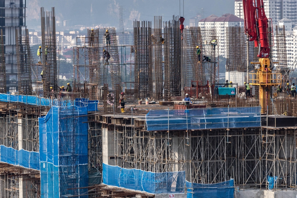 MIDF said the top three sectors that foreign investors net bought were construction (RM198.2 million), utilities (RM116.1 million) and industrial products and services (RM111.8 million). — Picture by Firdaus Latif