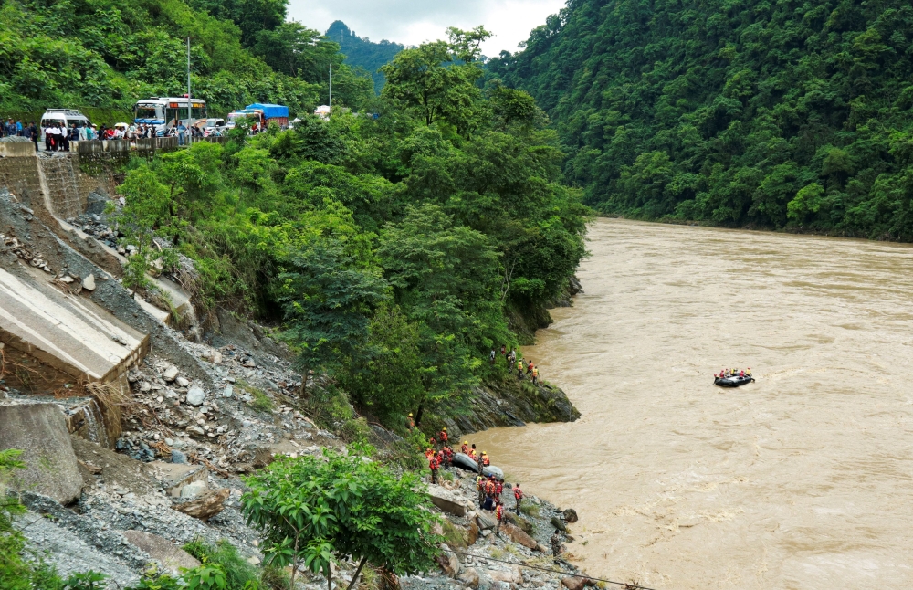 A Nepal rescue effort has turned into a search for bodies after two buses fell into the Trishuli River after a landslide at Simaltal area in Chitwan district on July 12, 2024. — Reuters pic