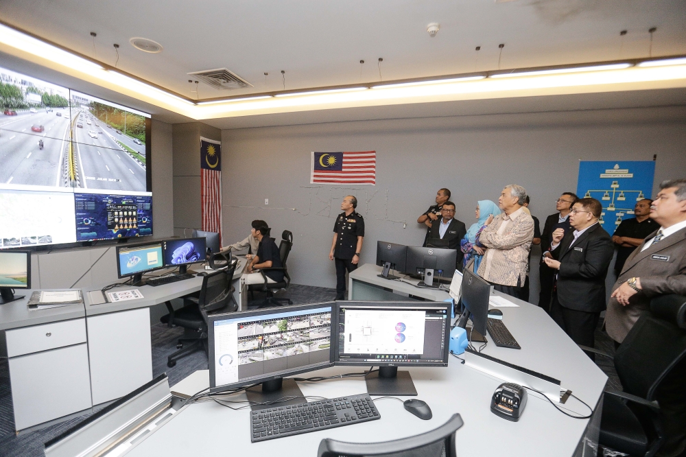 Deputy Prime Minister Datuk Seri Ahmad Zahid Hamidi (1st right) along with Federal Territories Minister Dr Zaliha Mustafa (2nd left) visit the Royal Malaysia Police control centre in Kuala Lumpur July 14, 2024. — Picture by Sayuti Zainudin