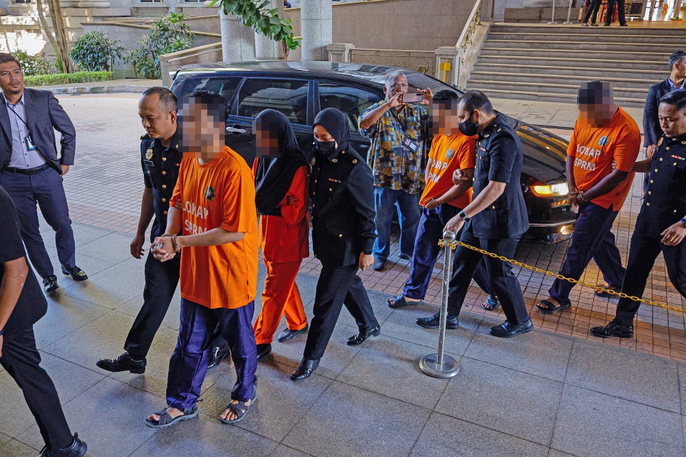 Yesterday, the remand order against the couple and two other individuals suspected of misappropriating public donations was extended for three days. — Bernama pic