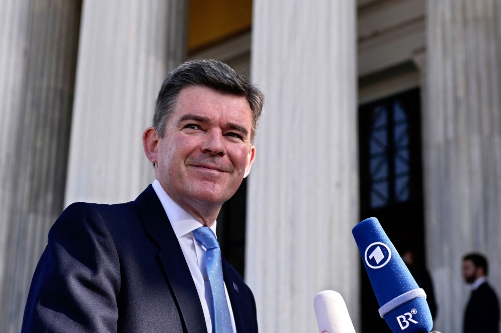 Britain's Minister of State for Foreign and Commonwealth Affairs, Hugh Robertson, arrives for the second day of the ministerial meeting of the EU and the League of Arab states at Zappion hall in Athens June 11, 2014. — AFP pic