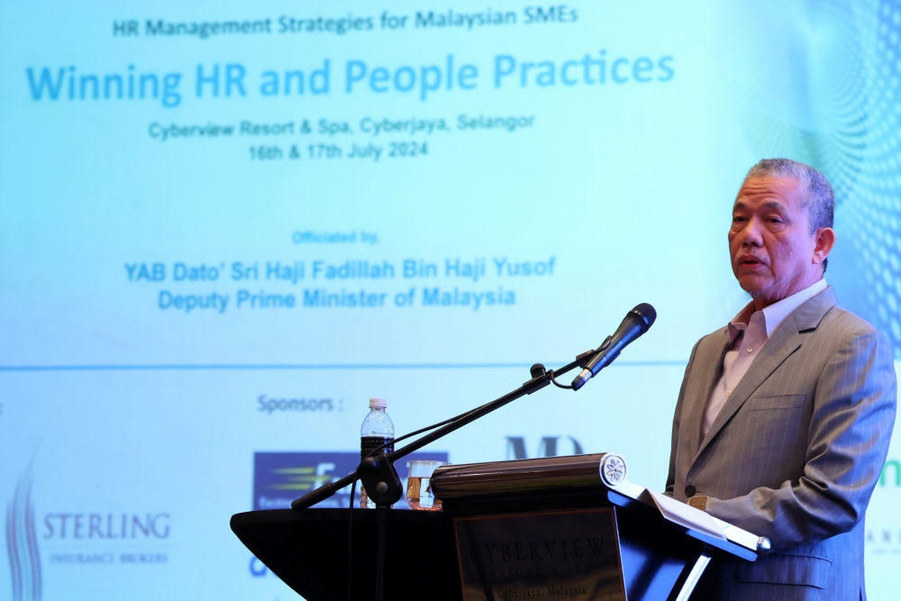 Deputy Prime Minister Datuk Seri Fadillah Yusof delivers a speech at the HR Management Strategies for Malaysian Small Medium Enterprises (SMEs) Conference in Cyberjaya, July 16, 2024. — Bernama pic 