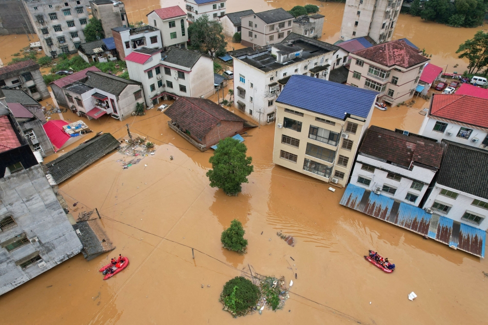 Aerial view of buildings submerged in floodwaters after heavy rains hit towns in Hunan provice July 2, 2024. — Reuters pic  