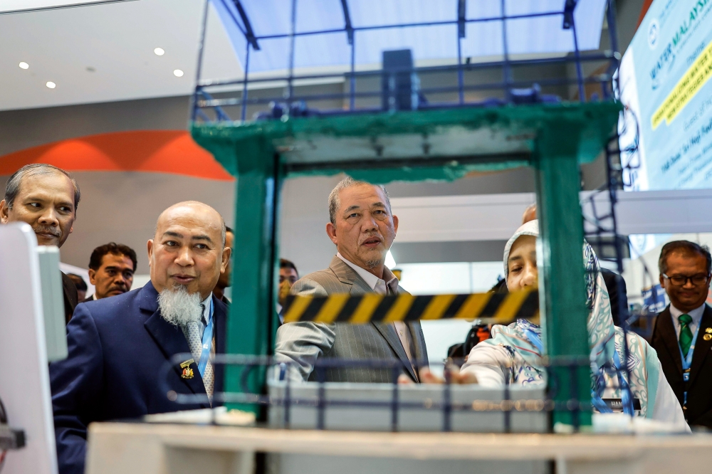 Deputy Prime Minister and Minister of Energy Transition and Water Transformation Datuk Seri Fadillah Yusof visits an exhibit at the Water Malaysia Specialised Conference and Exhibition 2024 in Kuala Lumpur, July 16, 2024. — Bernama pic 
