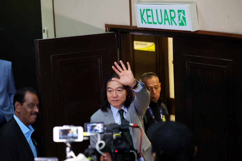 Harimau Malaya Head Coach Kim Pan Gon waves to media practitioners after the press conference announcing his resignation as head coach of the national squad at Wisma FAM in Petaling Jaya July 16, 2024. — Bernama pic