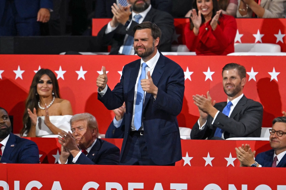 US Senator from Ohio and 2024 Republican vice-president candidate J. D. Vance gives a thumbs up alongside US former President and 2024 Republican presidential candidate Donald Trump. July 15, 2024. — AFP pic