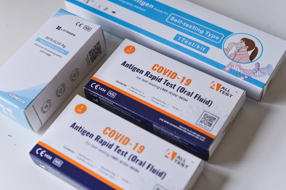 An undated file photograph shows Covid-19 home test kits. — Picture by Miera Zulyana