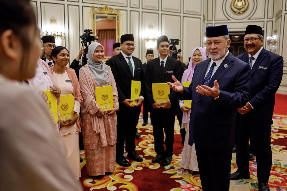 The King chats with the scholarship recipients after the Yang di-Pertuan Agong Scholarship Award Ceremony at Istana Negara in Kuala Lumpur July 17, 2024. — Bernama pic