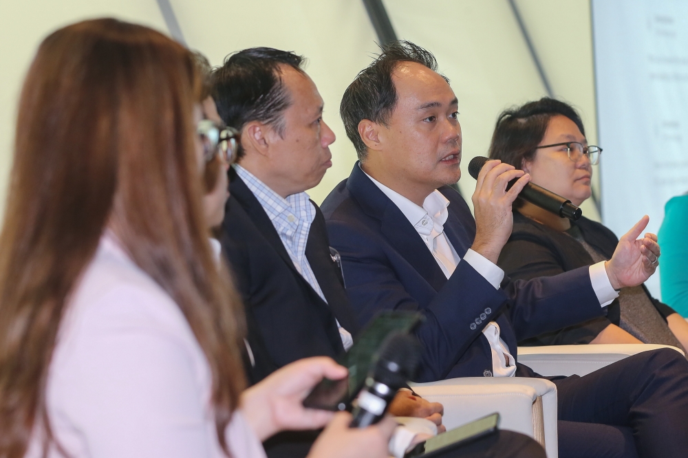 Group Managing Director Keith Ooi (centre) speaks during Knight Frank Malaysia's Real Estate Highlights 2024 Report at The MET Corporate Tower in Kuala Lumpur July 17, 2024. — Picture by Yusof Mat Isa
