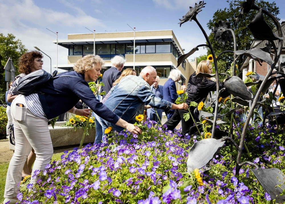 Relatives attend a memorial ceremony to mark the 10th anniversary of MH17 plane crash, carrying 298 at the Dudok Park in Hilversum, central Netherlands. —AFP pic