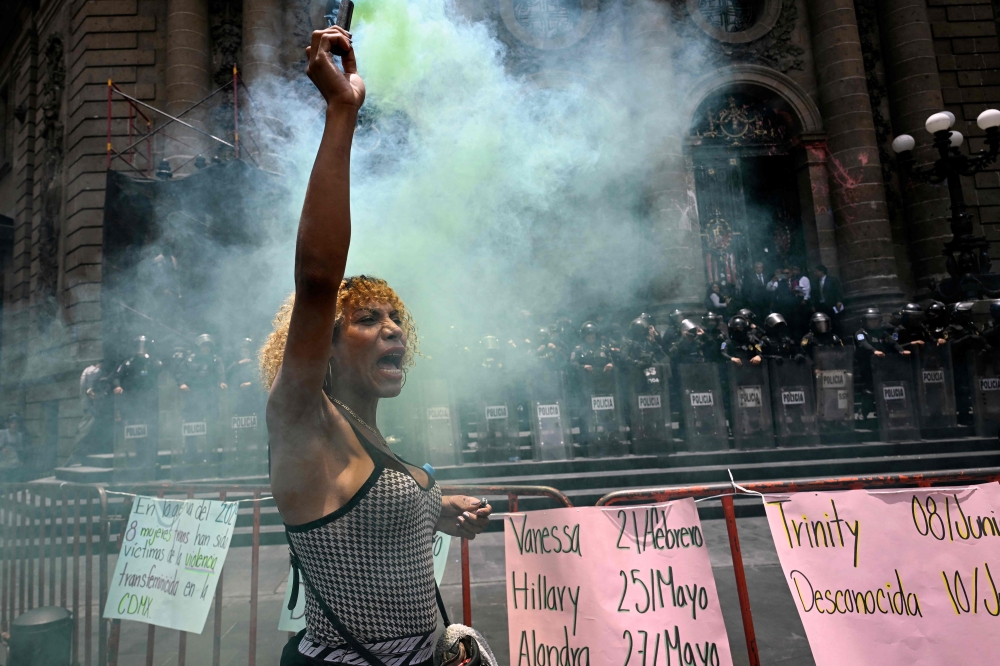 A group of activists celebrates outside of the local Congress after the discussion prior to the approval of the so-called ‘Paola Law’, which criminalises transfeminicide, in Mexico City July 18, 2024. — AFP pic
