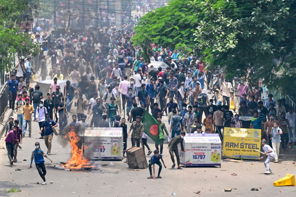 Bangladesh woke today to survey destruction left by the deadliest day of ongoing student protests so far, which saw government buildings torched by demonstrators and a nationwide internet blackout put into effect. — AFP pic