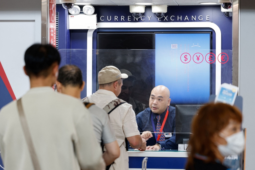 Screen showing an error is seen at a currency exchange store at Hong Kong International Airport amid system outages disrupting the operations, in Hong Kong July 19, 2024. — Reuters pic  