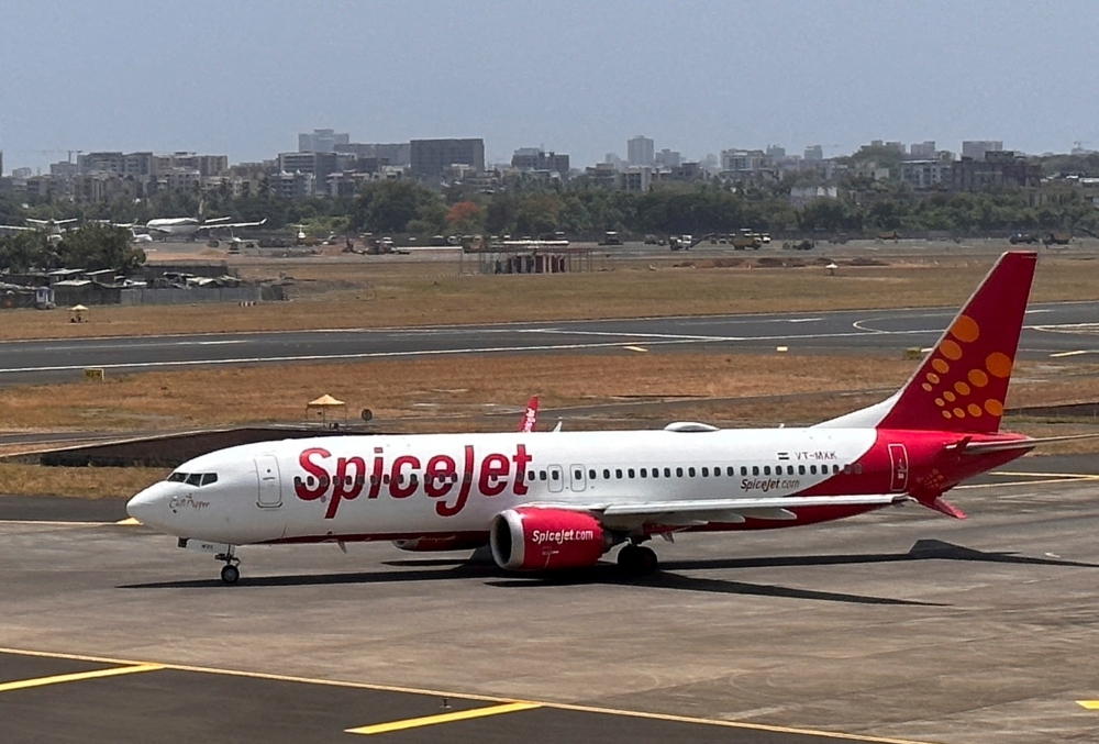 A SpiceJet passenger aircraft taxis on the tarmac at Chhatrapati Shivaji International Airport in Mumbai May 29, 2023. SpiceJet said it had reverted to manual check-ins and boarding after ‘technical challenges’. — Reuters pic  