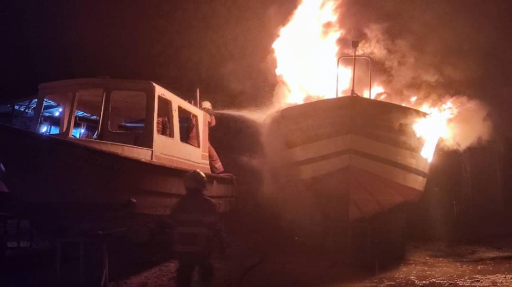 Mersing Fire and Rescue Station personnel bring the blaze under control at the MSG Boat Building yesterday. — Picture via Facebook/Balai Bomba & Penyelamat Mersing