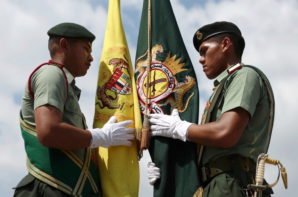 Bearer of the Royal Standard, Lieutenant Muhammad Ariff Mohamad Sholeh (left), alongside the bearer of the 1st Battalion Royal Malay Regiment (1 RAMD) Regimental Standard, Second Lieutenant Muhammad Yusof Hafize Ab Rahman, during the final rehearsal of the Royal Honour Guard for the Installation Ceremony of the 17th King Sultan Ibrahim at the Army Camp in Sungai Besi in Kuala Lumpur July 18, 2024. — Bernama pic