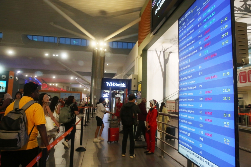 An information board shows flights delayed due to the worldwide IT services outage caused by CrowdStrike, in KLIA2 on July 19, 2024 — Picture by Choo Choo May.
