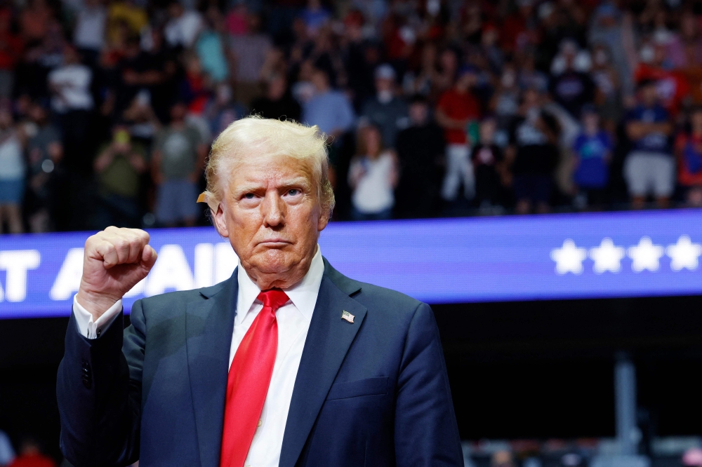 Donald Trump commanded the stage for nearly two hours yesterday in his first rally since a gunman tried to kill him last week, with a fiery, rambling speech to thousands of passionate supporters. — AFP pic