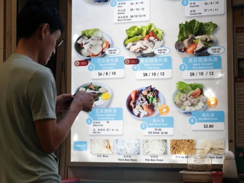 A menu displayed at a hawker stall selling fish and seafood soup, at Pasir Ris Central Hawker Centre. — All TODAY pic