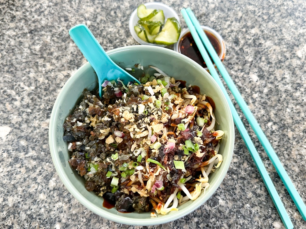 For a fun food adventure, try out Taiwan Spice Delights unusual Scallion Oil Century Egg Noodles — Pictures by Lee Khang Yi