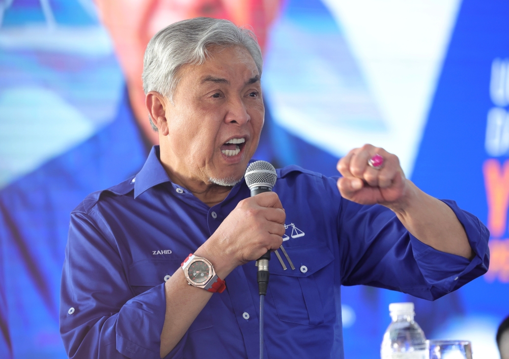 BN chairman Datuk Seri Ahmad Zahid Hamidi speaks at the Sabah BN Assembly and Sabah BN Convention in conjunction with the 50th Anniversary and Golden Jubilee Celebration of BN in Sandakan, July 21, 2024. — Bernama pic 