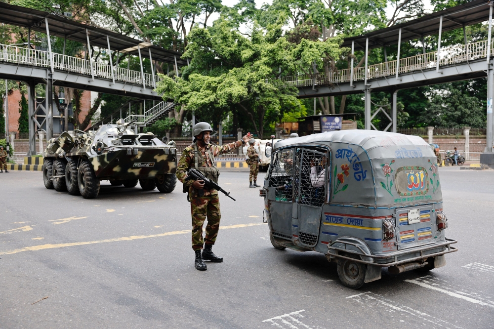 Members of the Bangladesh Army are seen on duty on the second day of curfew, as violence erupted in parts of the country after protests by students against government job quotas, in Dhaka, Bangladesh, July 21, 2024. — Reuters pic
