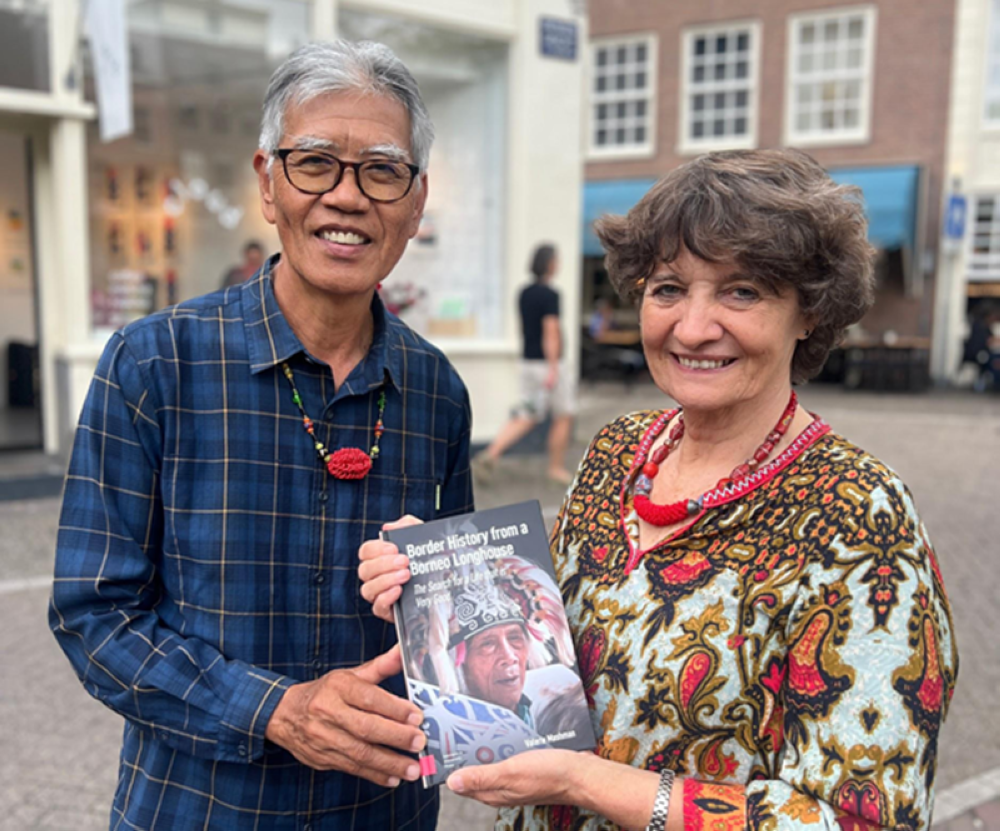 (From left) Datuk Ose Murang and his wife Datin Valerie Mashman pose with the book ‘Border History of a Borneo Longhouse’. — The Borneo Post pic 