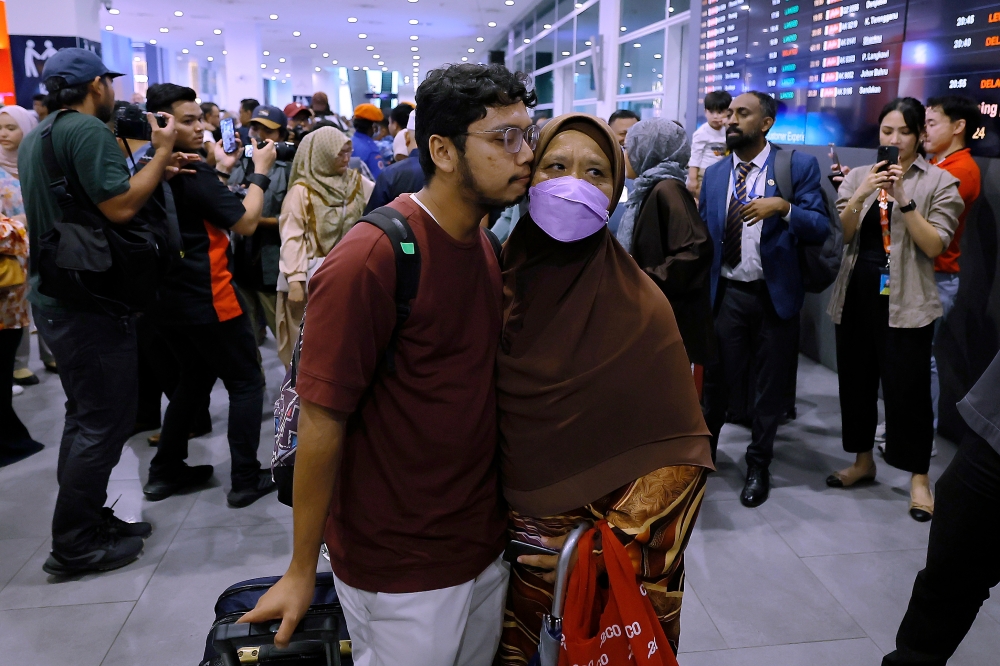 Malaysian citizens returning from Bangladesh are welcomed by their families upon arrival at Kuala Lumpur International Airport (KLIA2) Terminal 2, July 23, 2024. — Bernama pic 