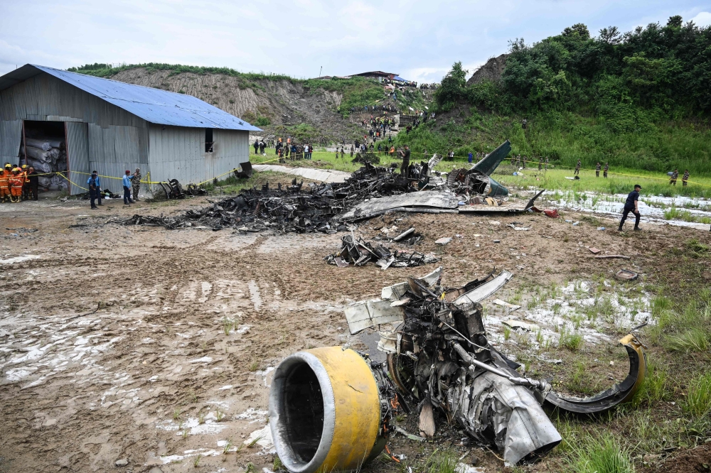 A passenger plane crashed on takeoff in Kathmandu today, with the pilot rescued from the flaming wreckage but all 18 others aboard killed, police in the Nepali capital told AFP. — AFP pic