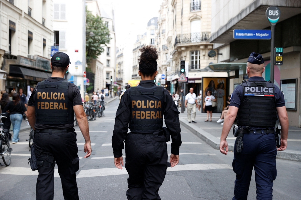 Police officers from France and Brazil are pictured on patrol in Paris, ahead of the Paris 2024 Olympics July 22, 2024. — Reuters pic  