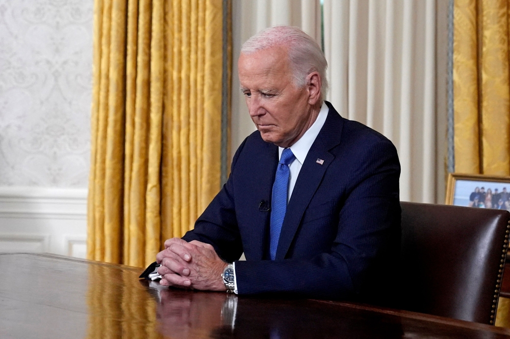 US President Joe Biden told Americans yesterday that he had dropped out of the 2024 election to unite his party and his country, saying in a historic Oval Office speech that it was in defence of democracy. — AFP pic