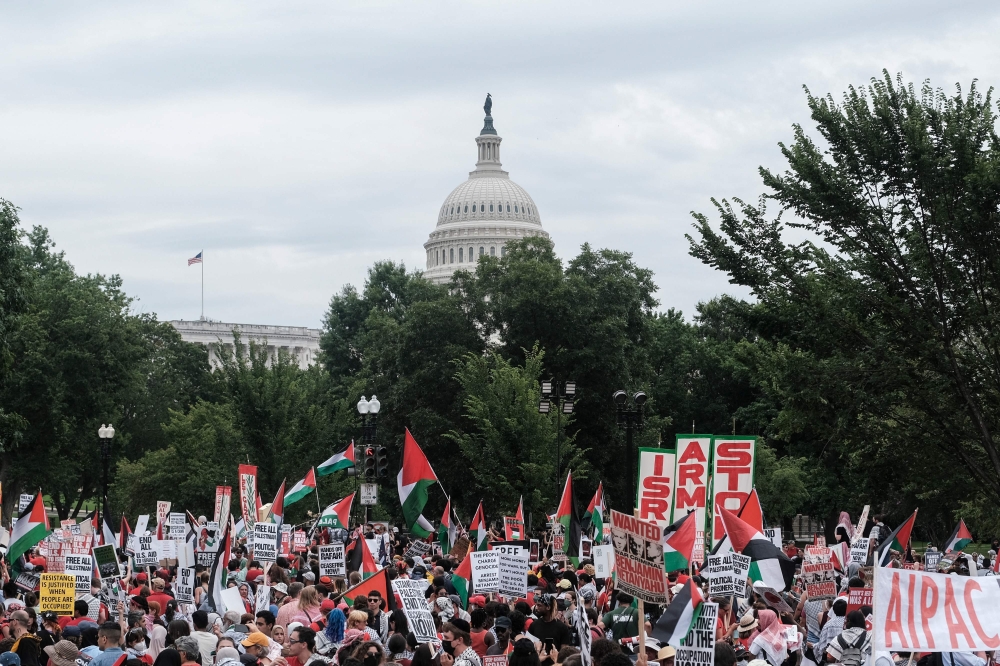 Thousands of demonstrators angry over the war in Gaza marched on the US Capitol yesterday as Israeli Prime Minister Benjamin Netanyahu asked lawmakers for steady support as his forces fight Hamas. — AFP pic
