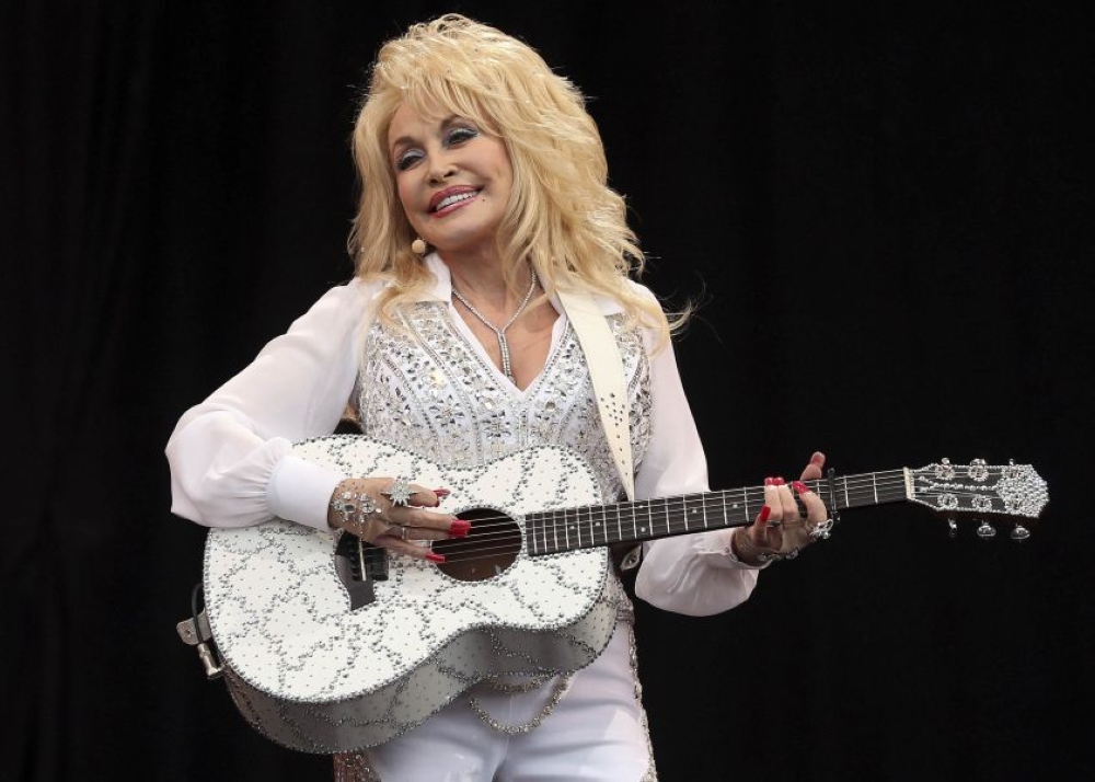 American country music star Dolly Parton performs on the Pyramid Stage at Worthy Farm in Somerset, during the Glastonbury Festival June 29, 2014. Academics explain that the tempo of songs varies according to the age of the musicians when they composed them. — Reuters pic