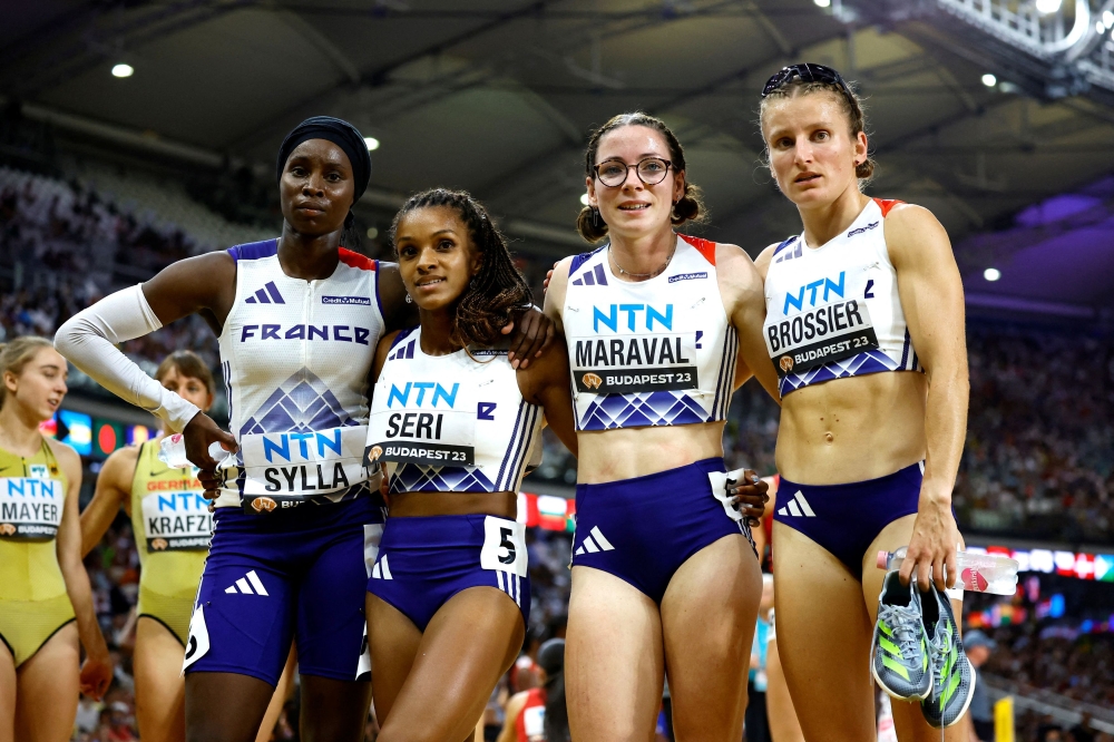 French government and Olympics officials are seeking a creative solution to allow Muslim French sprinter Sounkamba Sylla (far left) to wear her hijab at the opening ceremony while still complying with the country’s secularism laws. — Reuters pic