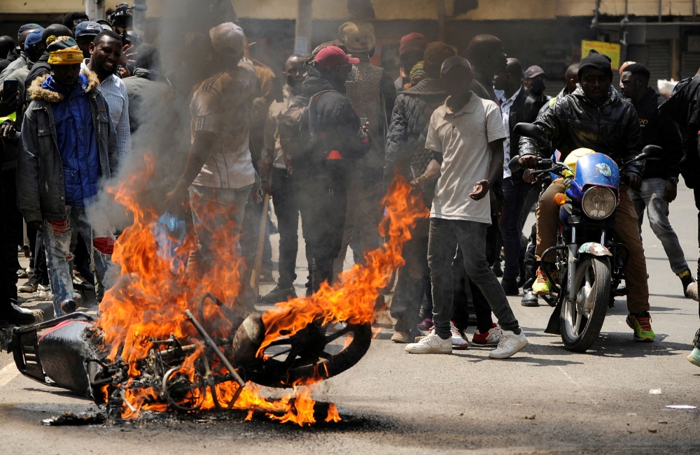 A motorcycle burns as protesters participate in an anti-government demonstration following nationwide deadly riots over tax hikes, in Nairobi July 23, 2024. — Reuters pic  