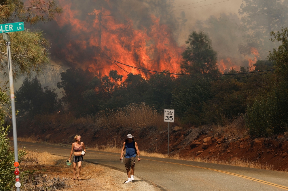 Flames and smoke plume rise as firefighters continue to tackle the Park Fire near the northern Sacramento Valley city of Chico, California, U.S. July 25, 2024. — Reuters pic