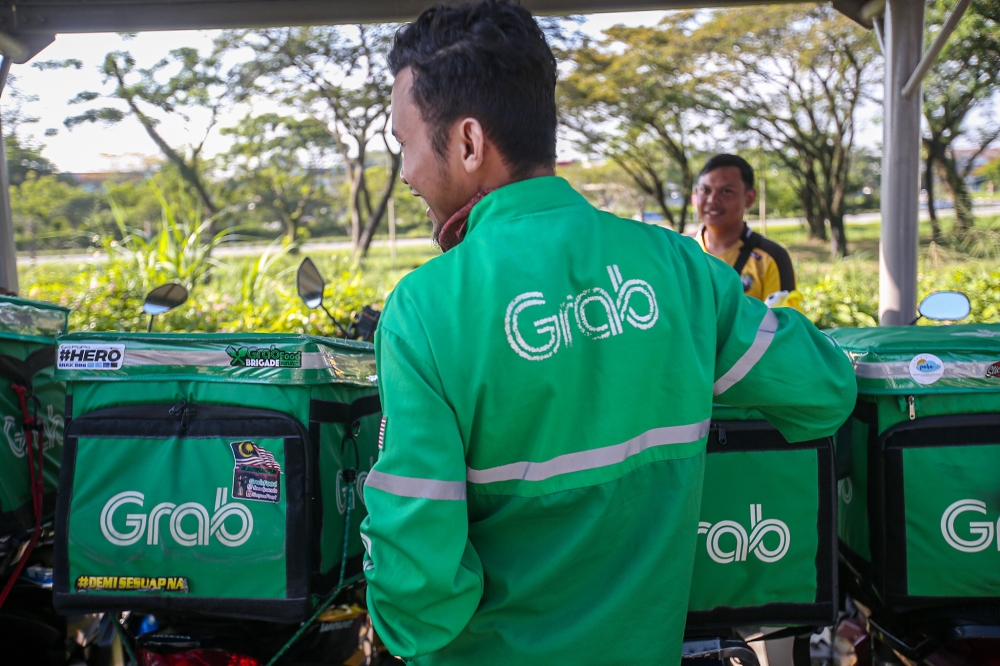 Grab is one of Singapore’s top ride-hailing companies, with the deal for Trans-cab reported to be worth around S$100 million. — Picture by Farhan Najib