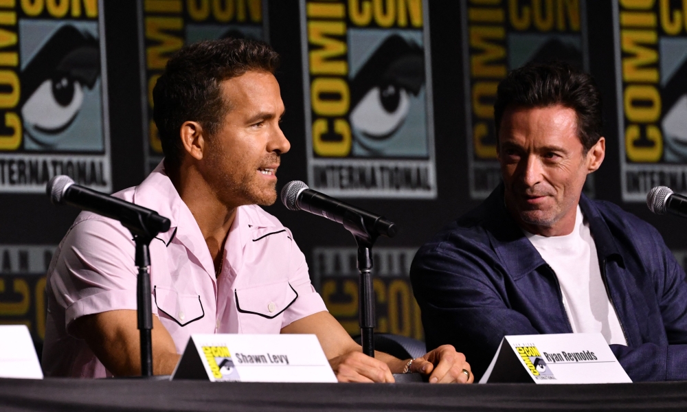 Ryan Reynolds and Hugh Jackman speak on stage during the ‘Deadpool & Wolverine’ fan event at Comic Con International in San Diego July 25, 2024. — AFP pic