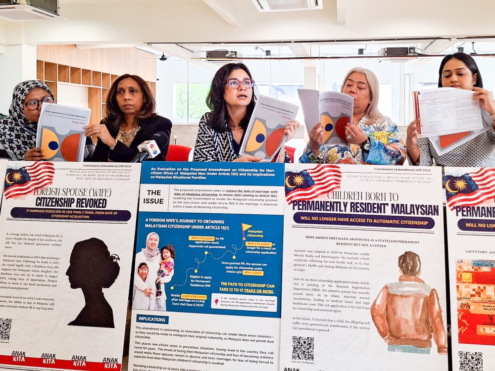 A file photograph shows members of the Malaysian Citizenship Rights Alliance (MCRA) and its counter-proposals to the government's Bill to amend citizenship laws. — Picture by Ida Lim